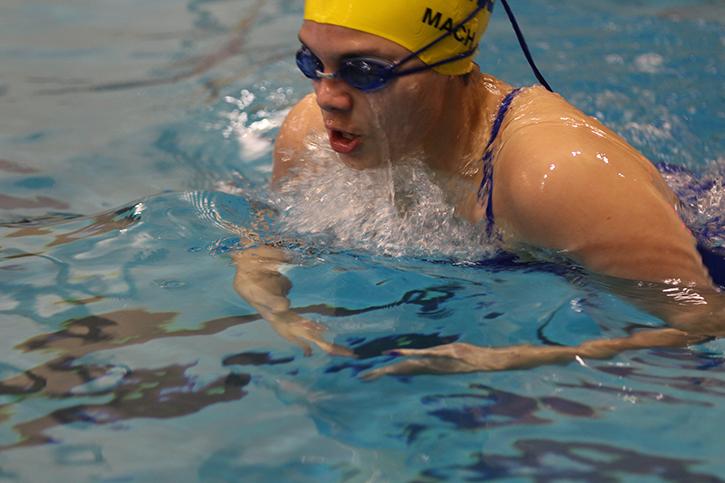 Freshman Luci Mach competes during a varsity swim meet Jan. 12 against Timberland.