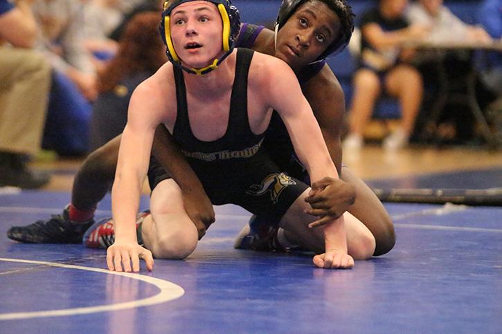 Sophomore+Anthony+Parrish+%28pictured+on+the+left%29+in+a+JV+wrestling+match+against+CBC+Jan.+14%2C+2016+at+Howell.
