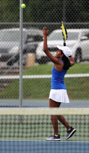 Junior Anindhitha Sudhakaran gets set to hit the tennis ball back over the net, Tuesday, Aug. 23, against their opponent Francis Howell Central. The match against central was a good game until it got rained out, Sudhakaran said. Its too bad we didnt get tp finish. The game is postponed to be rescheduled at a later date.