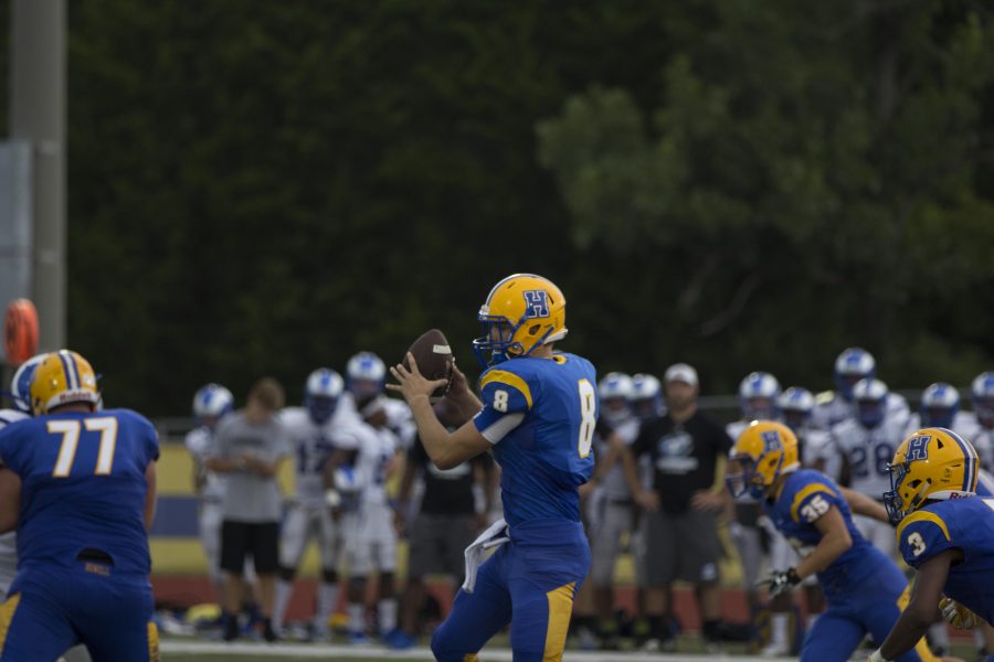 Aug 12, Junior Tyler Sprouse(8) passes the ball to his teammate in the Ladue game. The jamboree ended early due to storms. 