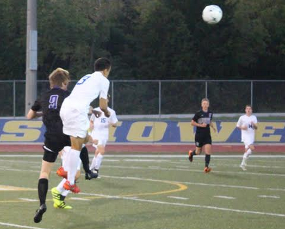 Trying to get possession of the ball, mid field senior, Connor Riley jumps to headbutt the ball against a player from Ft. Zumwalt West. Howell wins 2-0. 