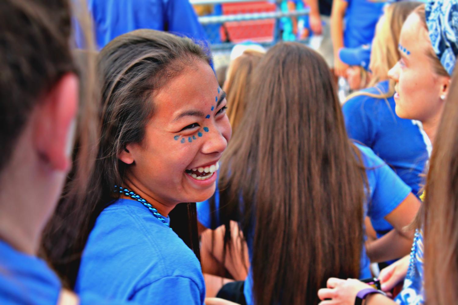 At the first varsity football home game against Mehlville, junior Sarah Stith covered herself in blue beads and face paint to follow the blue-out theme. I love going to football games and having a good time with my friends, Stith said.