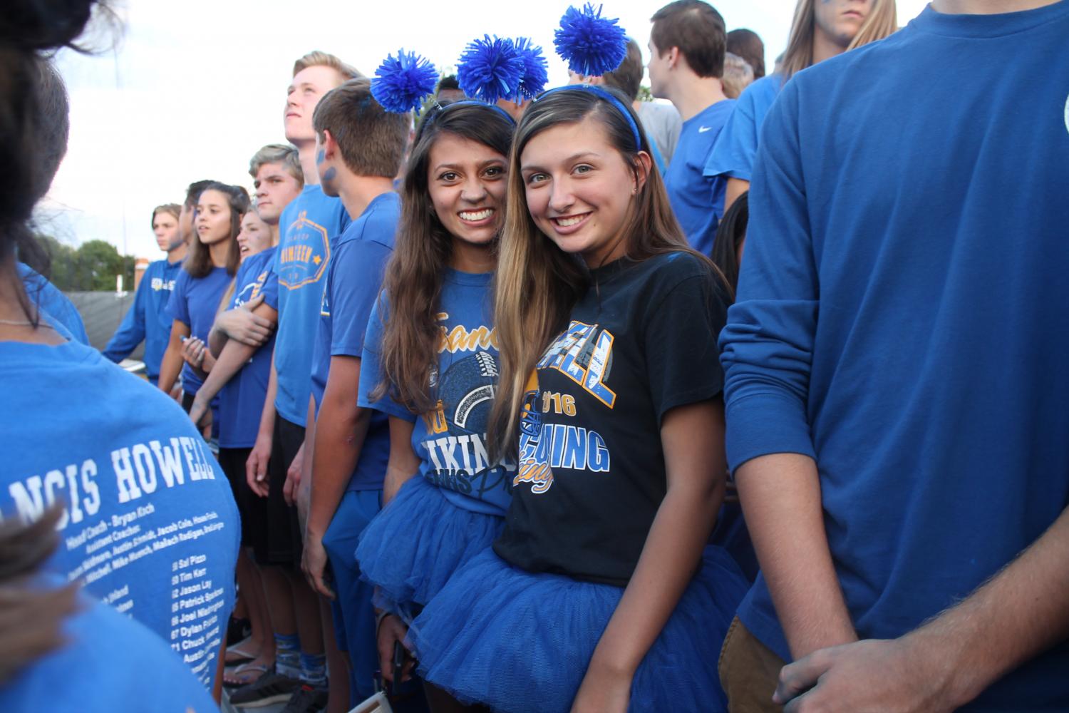 Dressed+in+blue+from+head-to-toe%2C+juniors+Sophia+Rizzo+and+Kennedy+Brewer+smile+for+the+camera+at+the+first+home+football+game.+Rizzo+and+Brewer+stood+in+the+superfan+section+wearing+matching+tutus+and+headbands+at+the+blue-out+game+on+Aug.+18.+%E2%80%9CI+love+how+our+school+is+so+hype+and+all+for+school+spirit%2C%E2%80%9D+Rizzo+said.