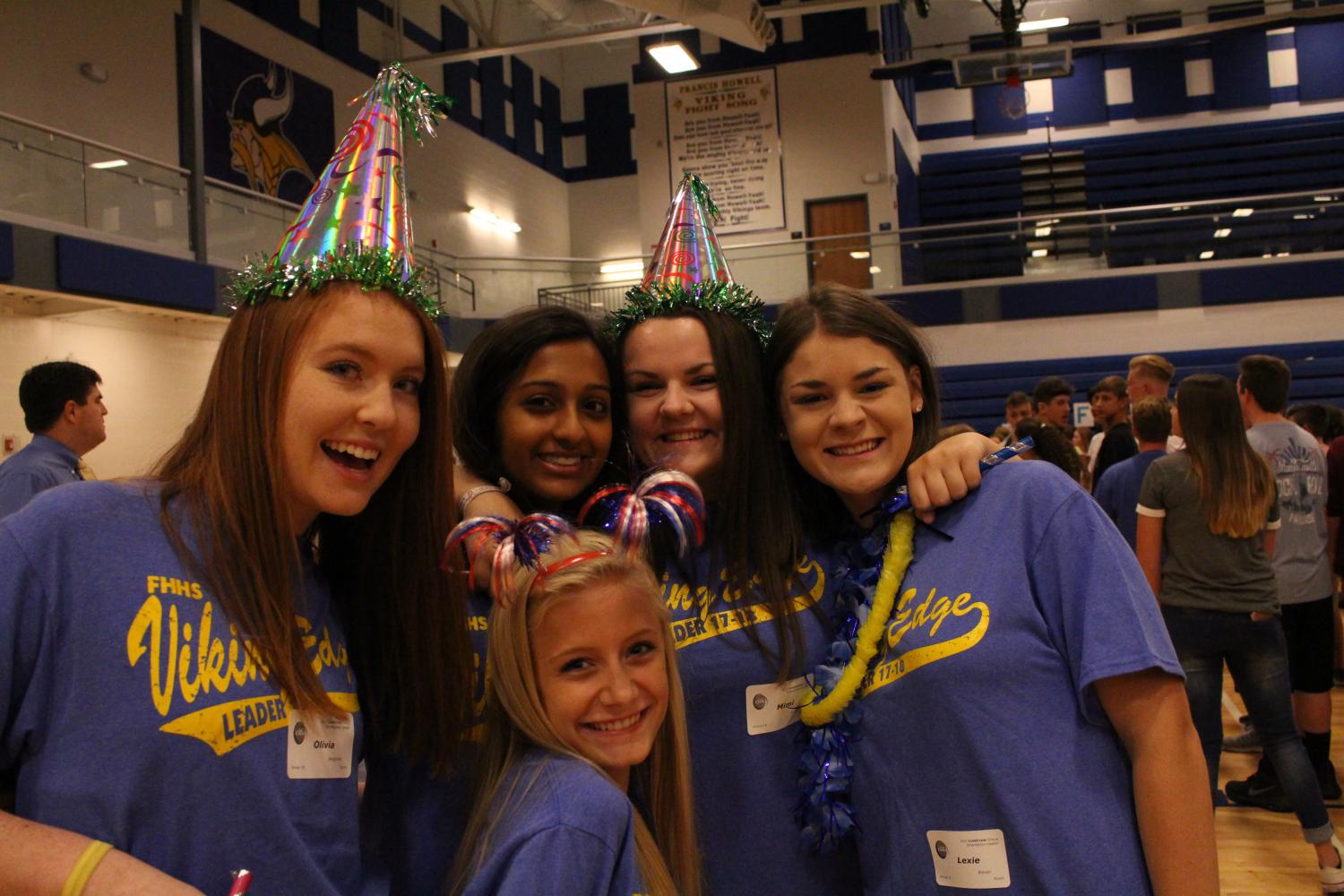 Smiling for the camera, seniors Olivia Besgrove, Jinal Bhagat, Shelby Fisher, Marilyn Schene, and Alexandra Biever volunteer at their final Viking Edge Transition Day. All of the girls have been Viking Edge leader’s for two years. “It was a great opportunity to help out the incoming freshman and also to be able to meet new people in our school” Schene said. 