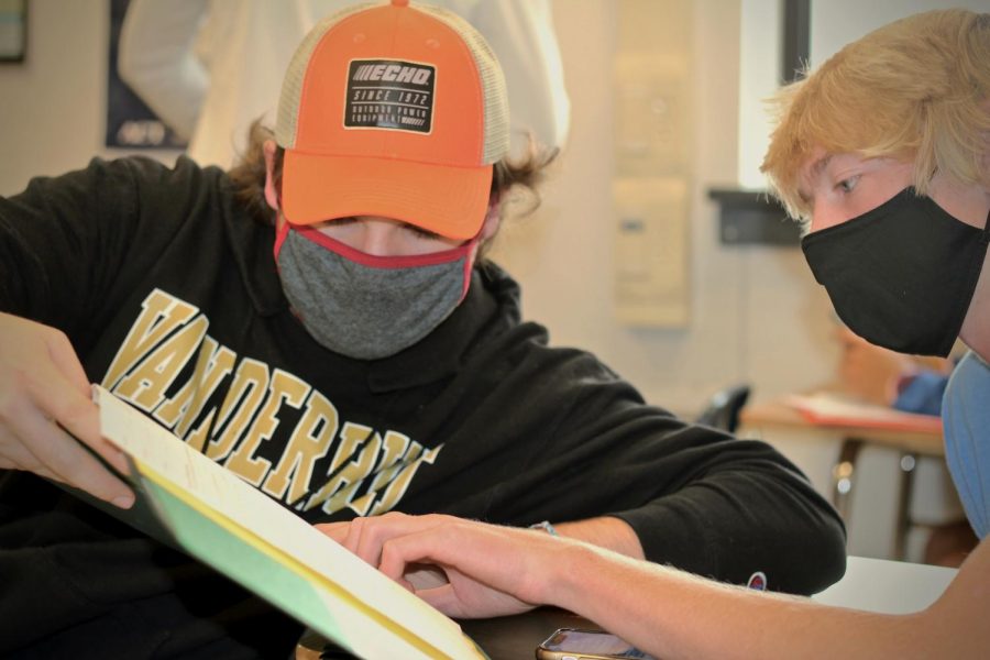 Juniors Alexander Richardson and Blake Walter work together on Pre-Calculus homework Sept. 10.