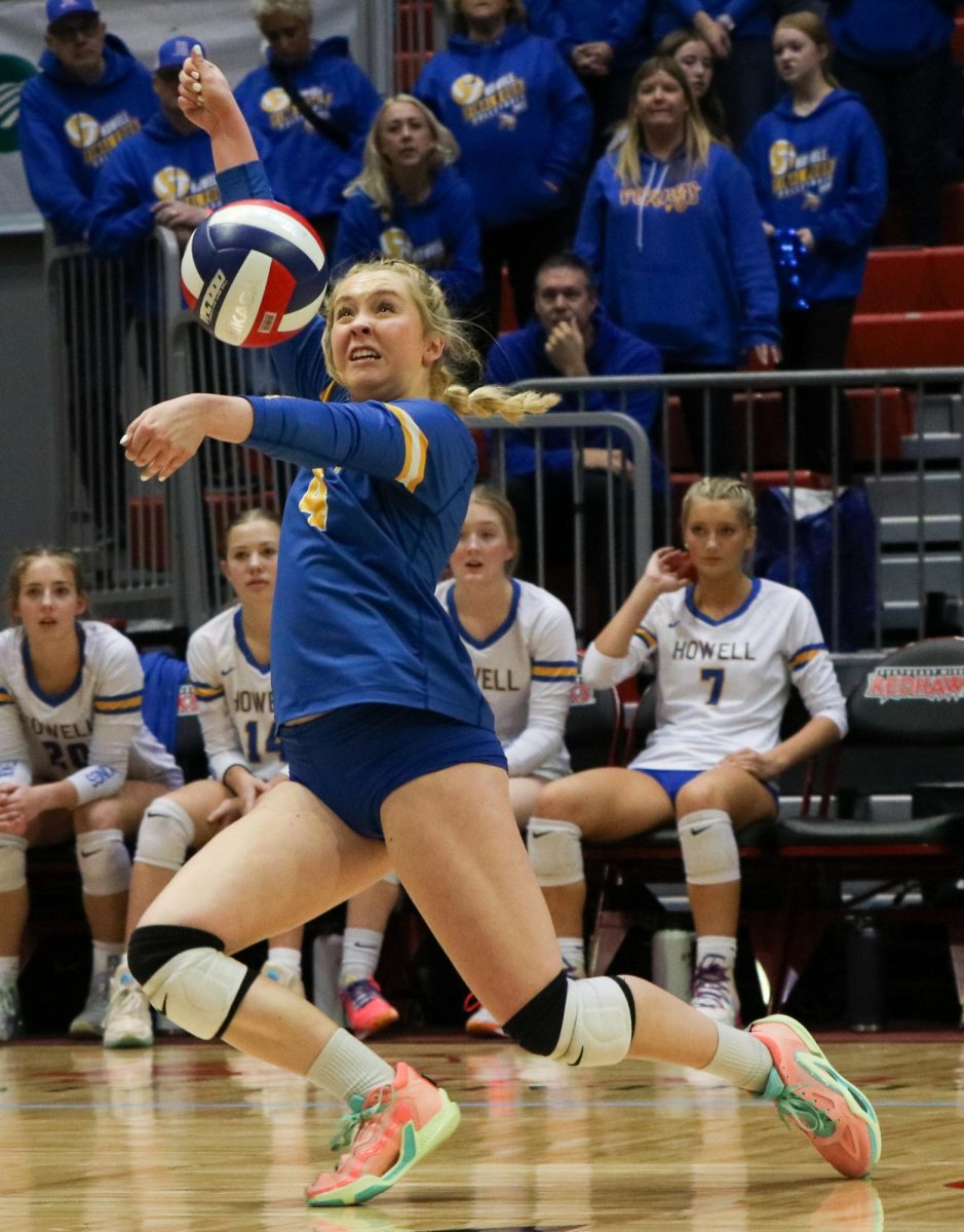 In the first set of the state semifinal game against Lee’s Summit West, junior Avery Helms (4) hits the ball, Nov. 2 at the Show-Me Center at Southeast Missouri State University. The Vikings beat the Titans 3-0, advancing to the state championship game.