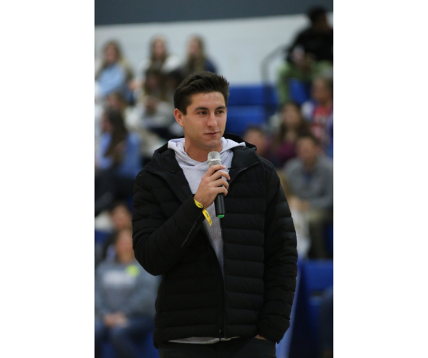 Guest speaker Patrick Schulte delivers a  speech at the Snow Place Like Howell winter assembly, Dec. 15.